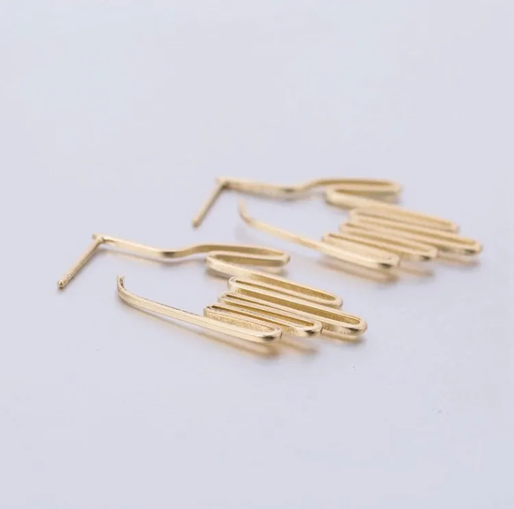A. Hand shaped earrings/silhouette style/hand therapy jewelry