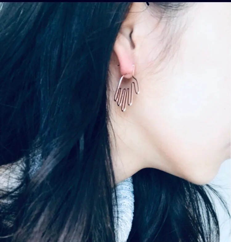 A. Hand shaped earrings/silhouette style/hand therapy jewelry